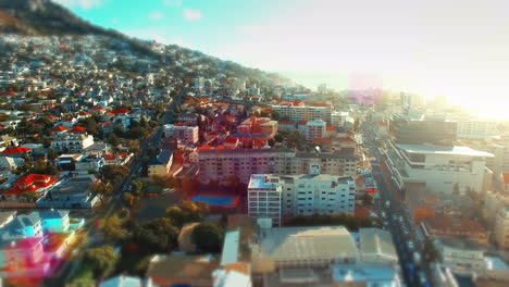 Lens-flare,-aerial-drone-view-of-urban-city