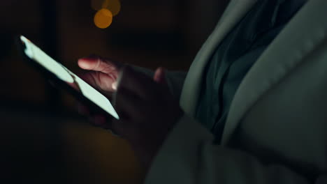 Business-hands-scroll-smartphone-at-night