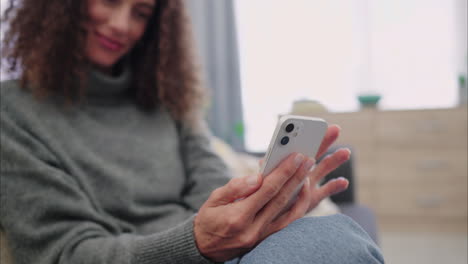 Phone,-social-media-and-woman-sitting-at-home-to