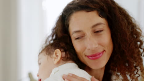 Love,-home-and-mom-lulling-baby-to-sleep-nursery