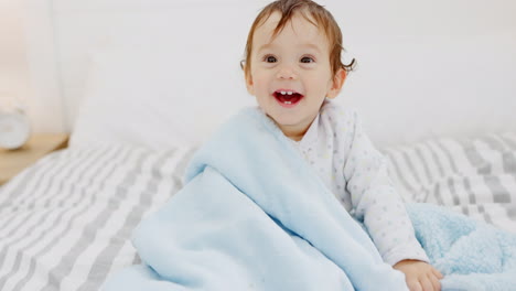 Happy,-baby-and-smile-at-home-on-a-bedroom-bed