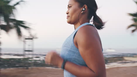 Music,-running-and-woman-exercise-in-a-city