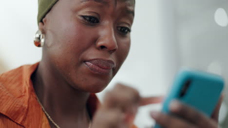 Black-woman-with-smartphone,-crying-and-sad