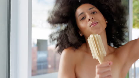 Dance,-hair-care-and-black-woman-with-brush