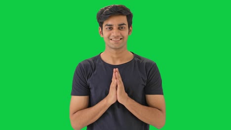 Cute-Indian-boy-doing-Namaste-Green-screen