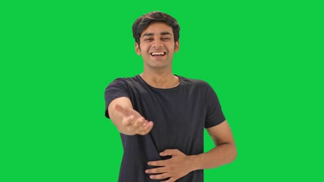 Cute-Indian-boy-laughing-on-someone--Green-screen