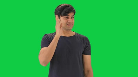 Indian-boy-disgusted-by-bad-smell--Green-screen