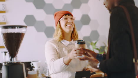 Happy-barista-and-woman-at-cafe-with-coffee