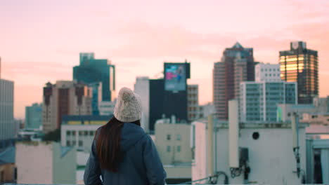 Girl,-city-and-buildings-with-sunset-in-sky