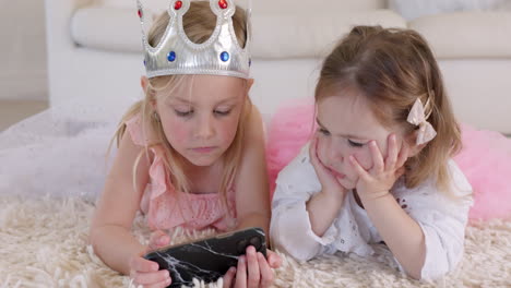 Watching-videos,-phone-and-children-on-floor