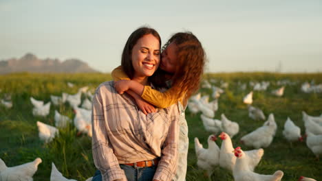 Hug,-child-and-mother-on-a-farm-with-chicken