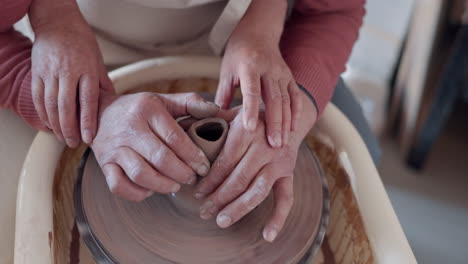 Love,-pottery-and-hands-of-old-couple-molding
