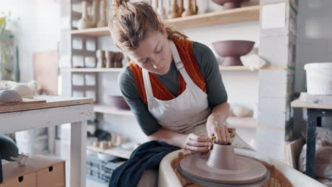 Pottery,-woman-artist-and-clay-mold-with-wheel