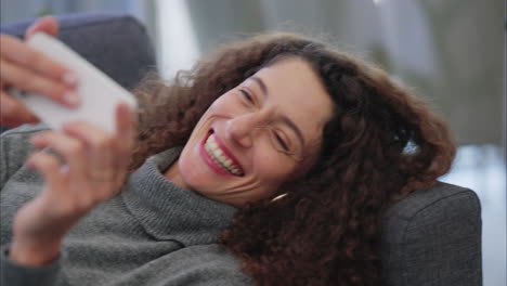 Relax,-phone-and-woman-laughing-while-watching