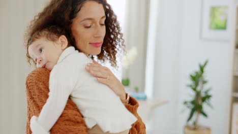 Love,-home-and-mom-hugging-baby-to-sleep-nursery