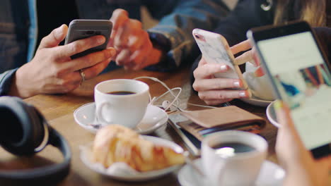 Cafe-friends,-phone-hands-and-social-media-online