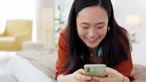 Social-media,-happy-and-asian-woman-on-bed