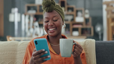Coffee,-phone-and-laughing-black-woman-on-sofa