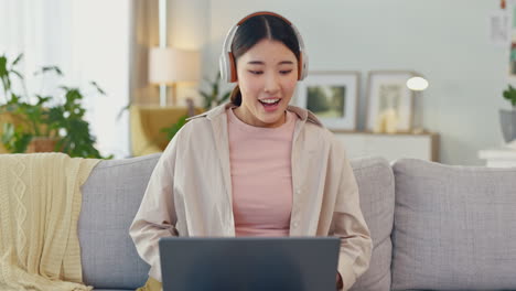 Woman,-headphones-and-laptop-with-winner-on-home