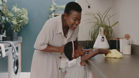 Black-woman,-mother-and-child-learning-cleaning