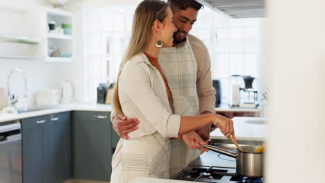 Couple,-cooking-and-together-in-kitchen