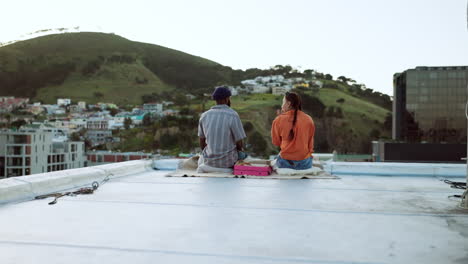 Couple,-city-rooftop-and-relax-together-with-love