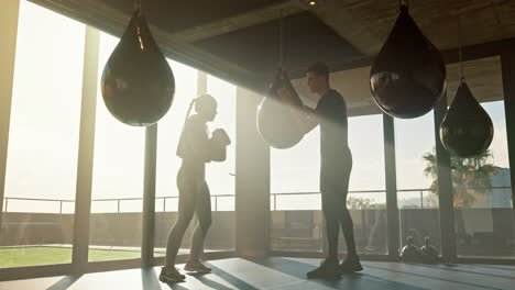 Sports,-boxing-and-woman-with-personal-trainer