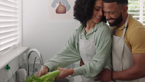 Black-couple,-bonding-and-cleaning-vegetables