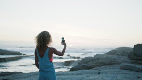 Woman,-phone-and-photo-of-beach