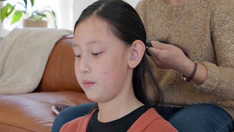 Asian-child,-home-hair-braid