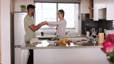 Couple,-dance-and-cooking-healthy-food-in-kitchen
