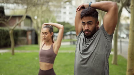 Couple,-city-fitness-and-stretching-arm-exercise