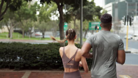 Running-couple,-city-fitness-and-road-crosswalk