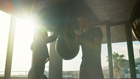 Fitness,-woman-and-boxer-high-five-with-personal