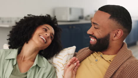 Black-couple,-talking-and-relax-together-on-couch