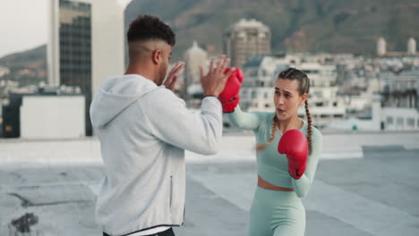 Fitness,-personal-trainer-and-woman-boxing