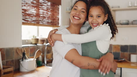Love,-mother-and-girl-hug-in-house-kitchen