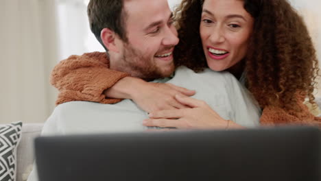 Laptop,-couple-watch-movie-on-sofa