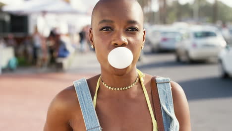 Black-woman,-face-and-blowing-bubble-with-gum