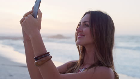 Phone-selfie,-beach-and-profile-of-woman