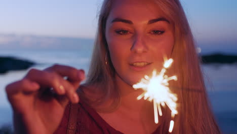 Face,-sparkler-and-new-year-with-a-woman