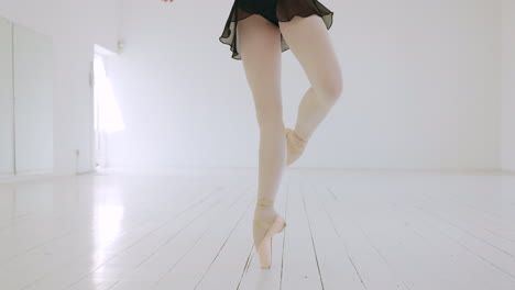 Ballet,-feet-and-balance-of-woman-in-dance-studio