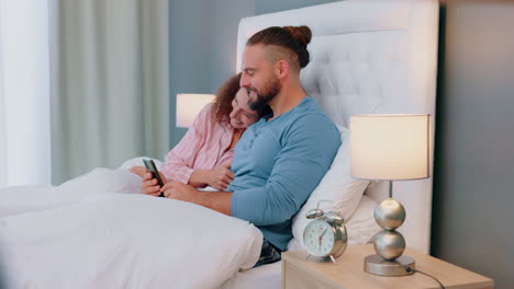 Love,-phone-and-couple-in-bed-talking