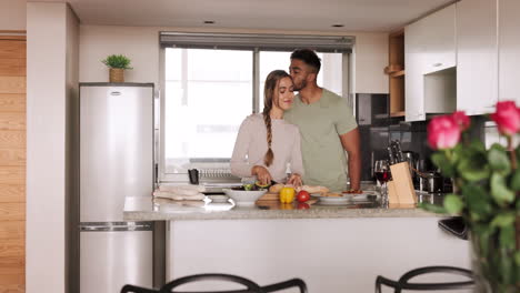 Kiss,-couple-and-cutting,-cooking-in-kitchen