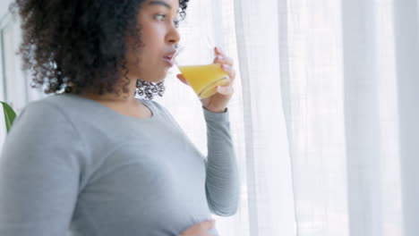Morning,-pregnant-and-happy-black-woman-with-juice