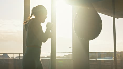 Boxing,-energy-and-woman-training-with-a-punching