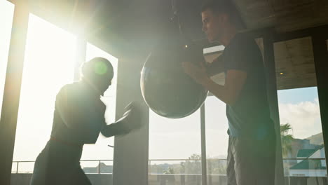 Boxing,-woman-and-personal-trainer-with-fist