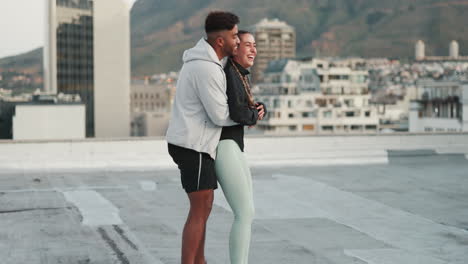 Hug,-fitness-and-couple-training-on-a-rooftop