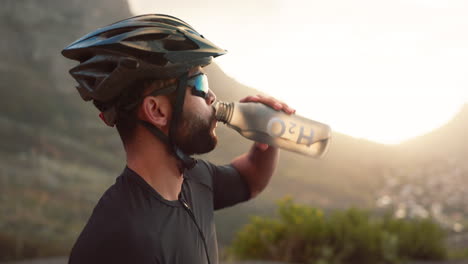 Fitness,-break-and-man-cyclist-drinking-water