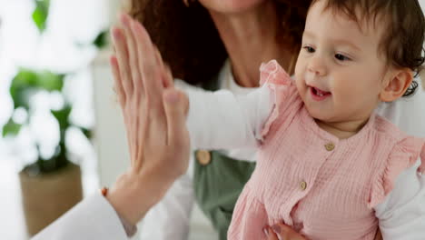 Mother,-baby-girl-or-doctor-high-five-for-medical